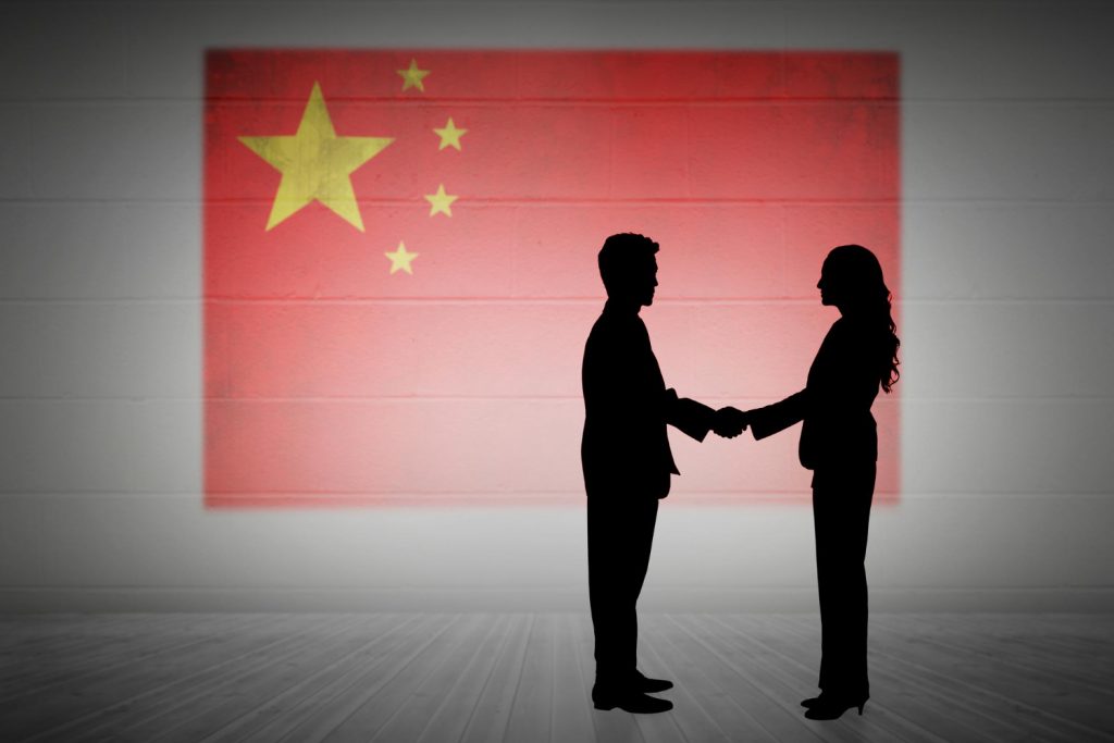 China's Tops Import And Exports 28 composite image silhouette business people shaking hands